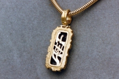 Opal and gold pendant